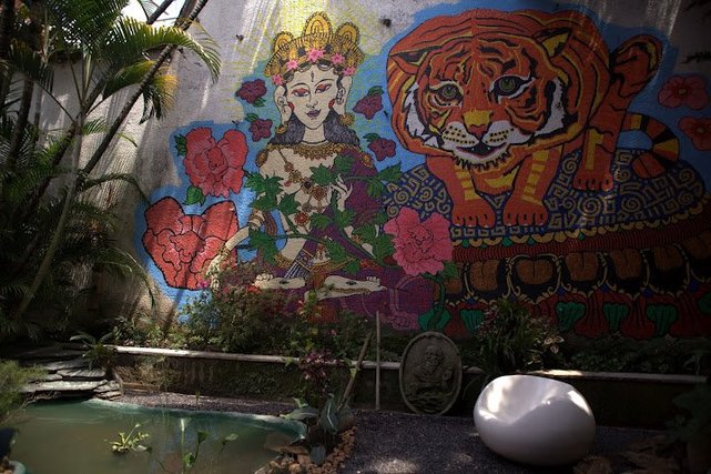 The garden, decked out with a mural and a koi pond. 