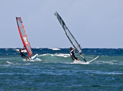 Two windsurfers racing