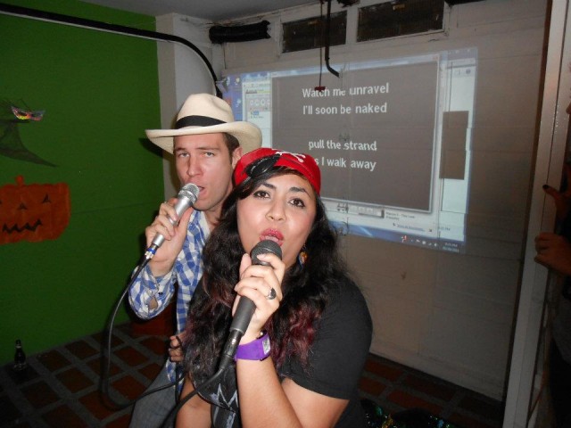 Brent and Gisela rock the mic on karaoke night. 