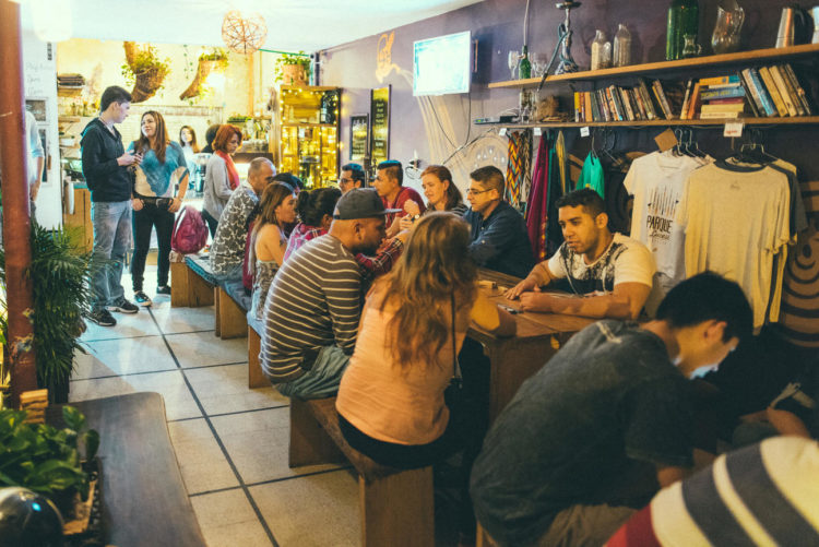 The activity at Ondas centers around the big communal table (photo courtesy of Café Ondas)
