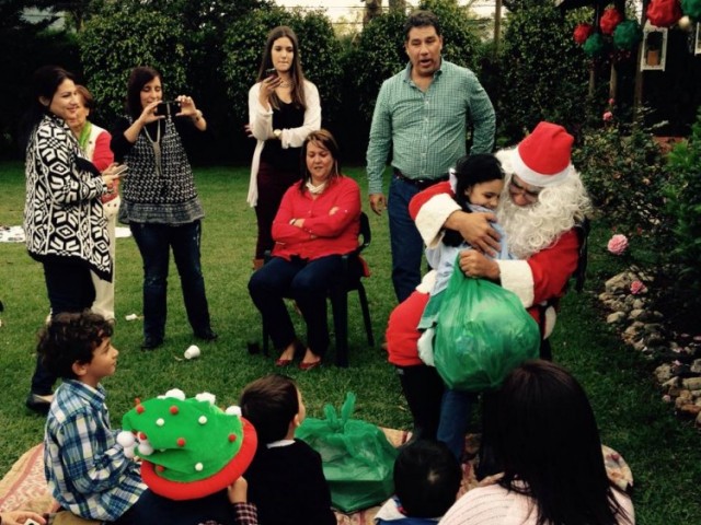 Santa Claus handing presents to children