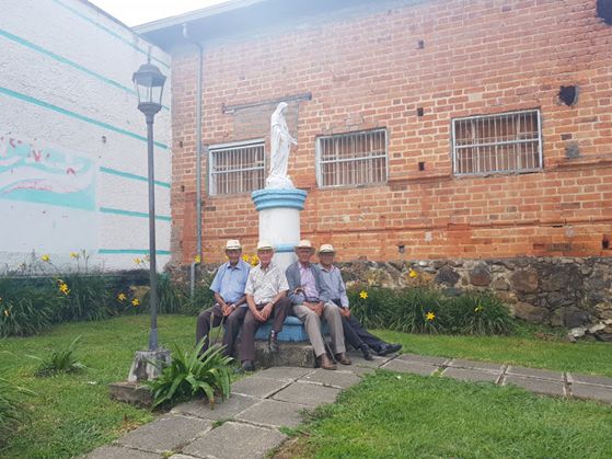 Local men wearing traditional hats in Jerico