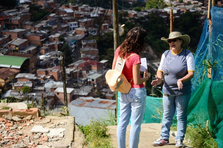 Sara Vallejo from E2E talks with one of the leaders of the JAC, Villa Liliam in La Comuna 8