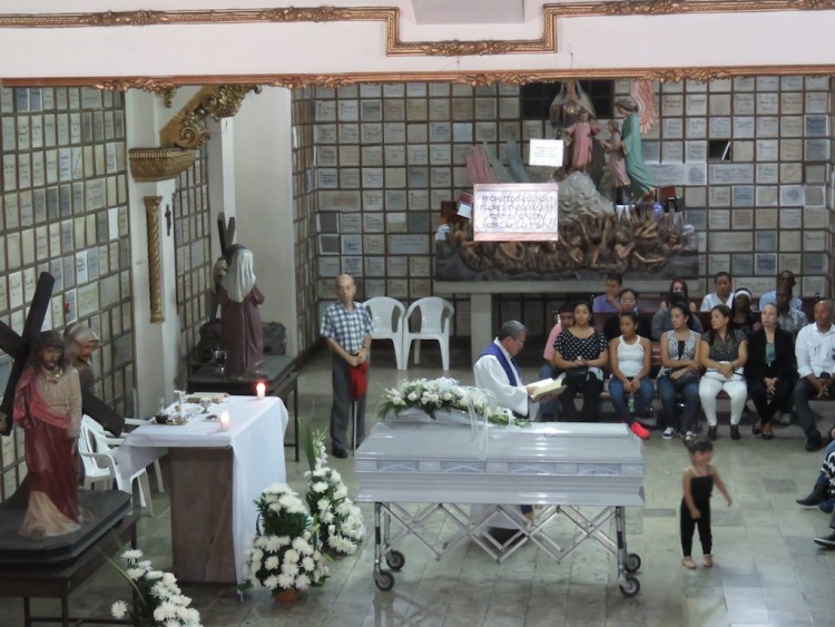 Funeral services in the basement of Iglesia Jesús Nazareno