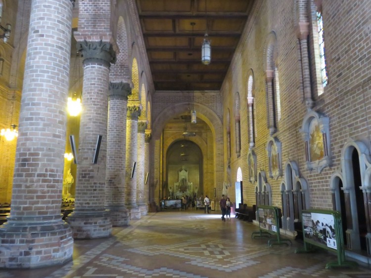 The right side aisle with confessionaries along the wall