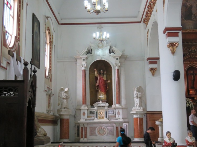 At the front of the left aisle inside Iglesia de San José