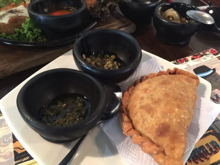 Meat empanada with marinated lentils and chimichurri