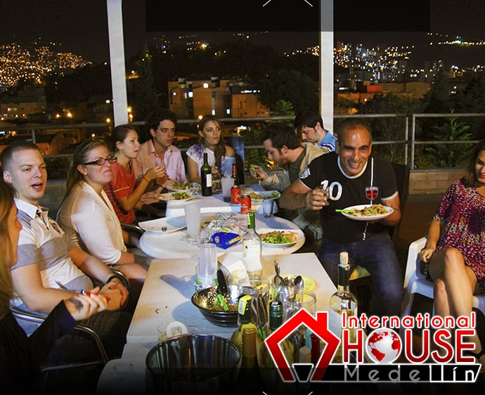 Hostel guests enjoying a nice meal with a view
