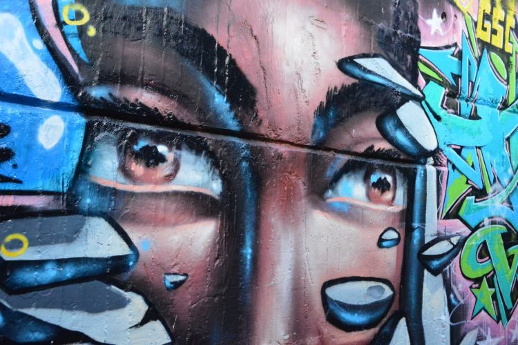 Watch out for the captivating eyes of the Comuna 13 street art