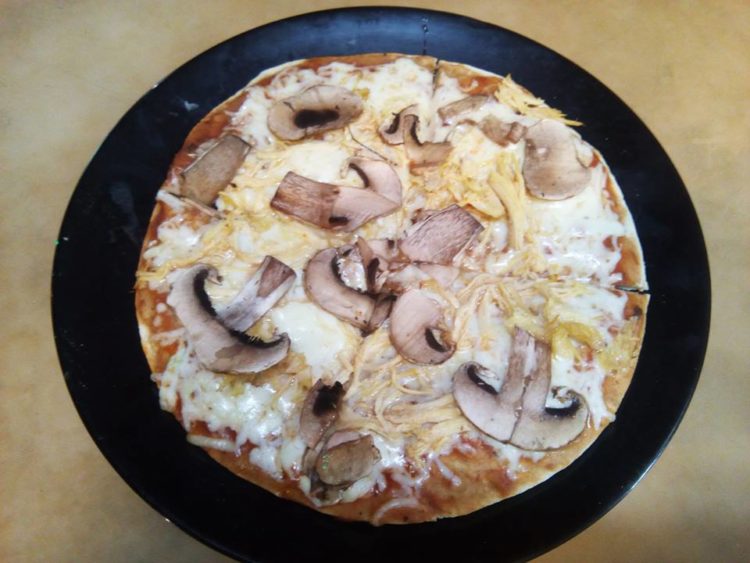 Chicken and mushroom pizza is a super deal at Super Pizza