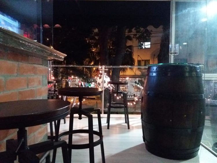 Balcony overlooking the street for open air dining and drinking