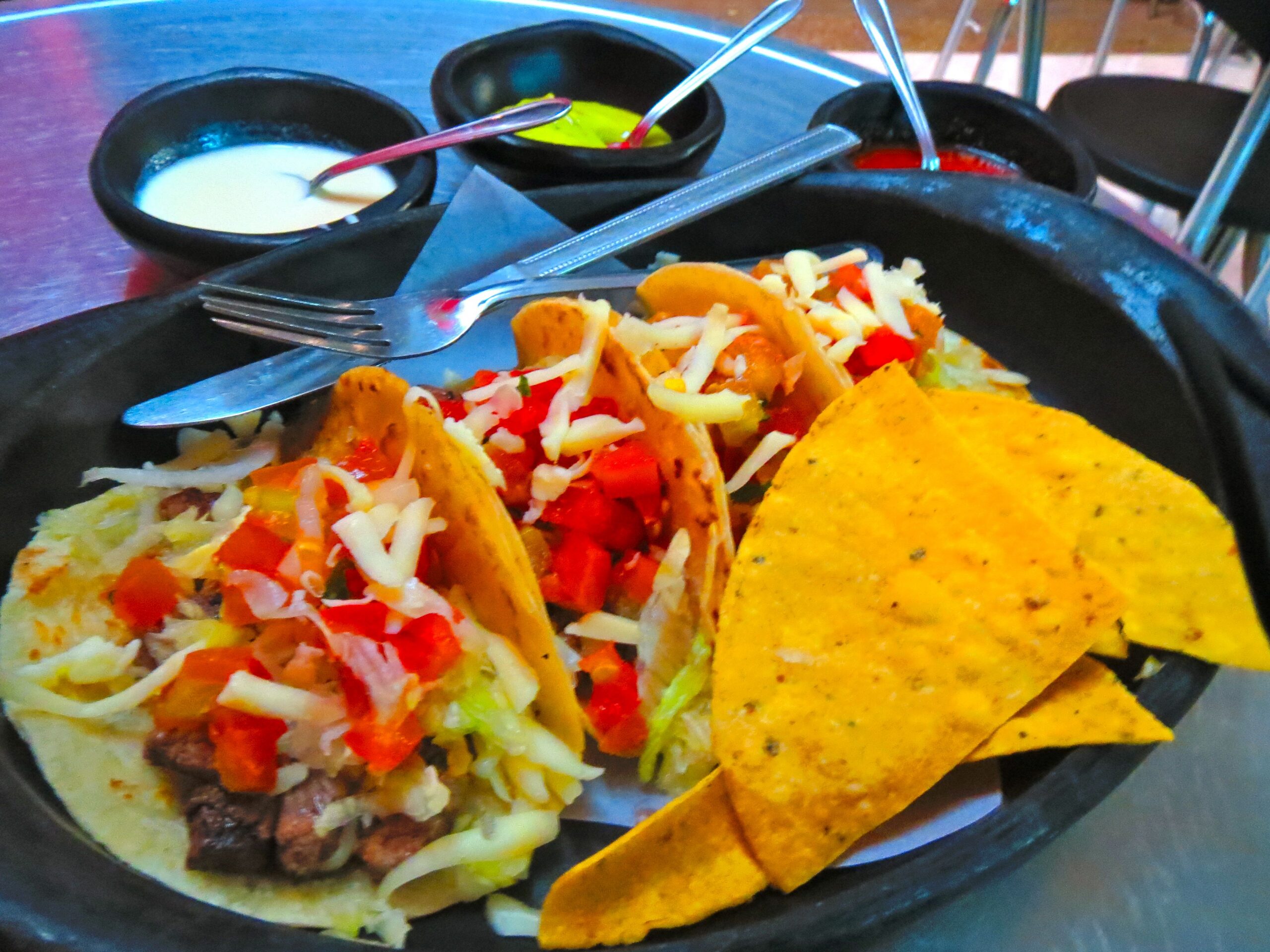 At Ernesto's Taco Shop, I recommend the "tres amigos." Although if you count the tacos, there are four, so the name of the dish is misleading in a good way.