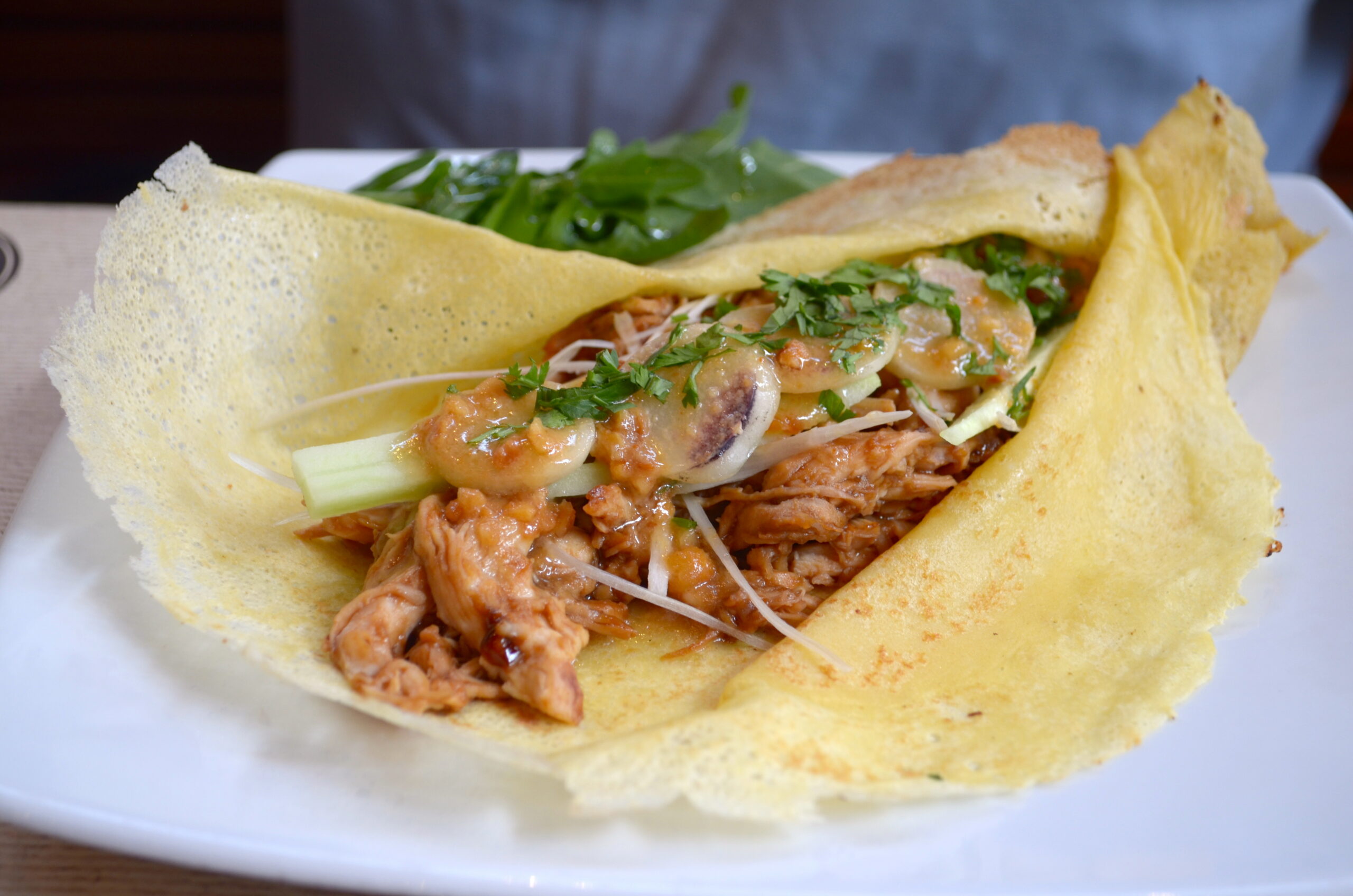 She paired her black dress with neon pink heels.