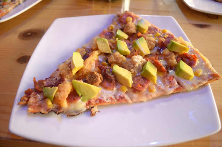 The combination of smooth avocado and crunchy chicharron make for a delicious pizza. 9,800 COP ($3.70)