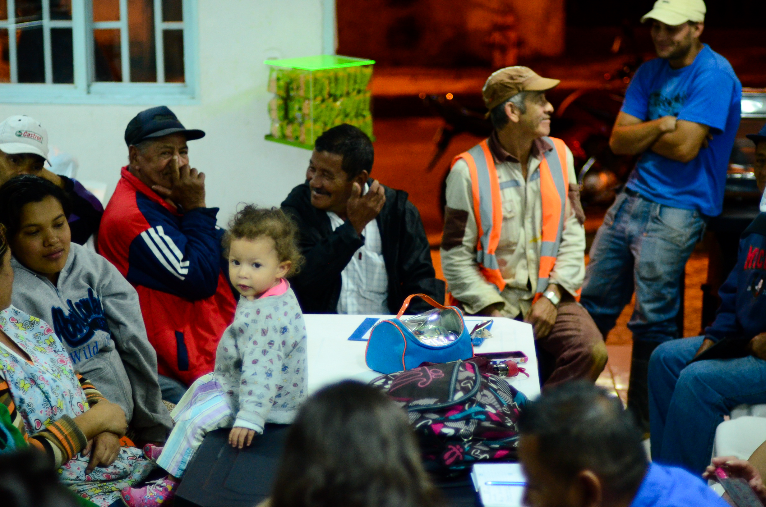 Residents of Villa Turbay attend an E2E meeting to discuss organizing a community recycling system