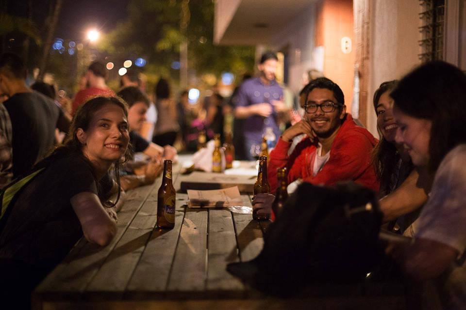 Language exchangers enjoying some beers on the patio at Colombia Immersion
