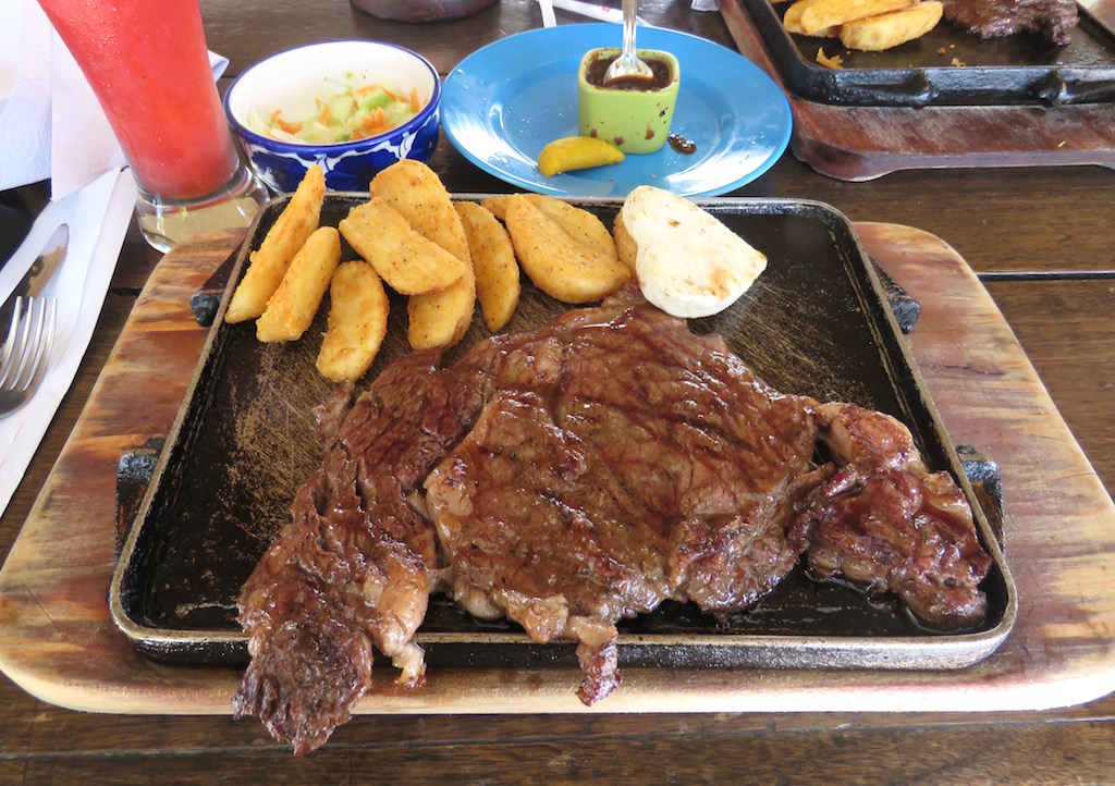 Angus ribeye steak with fries