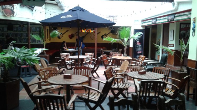 Open-air dining area in the middle of Medellin Beer Factory