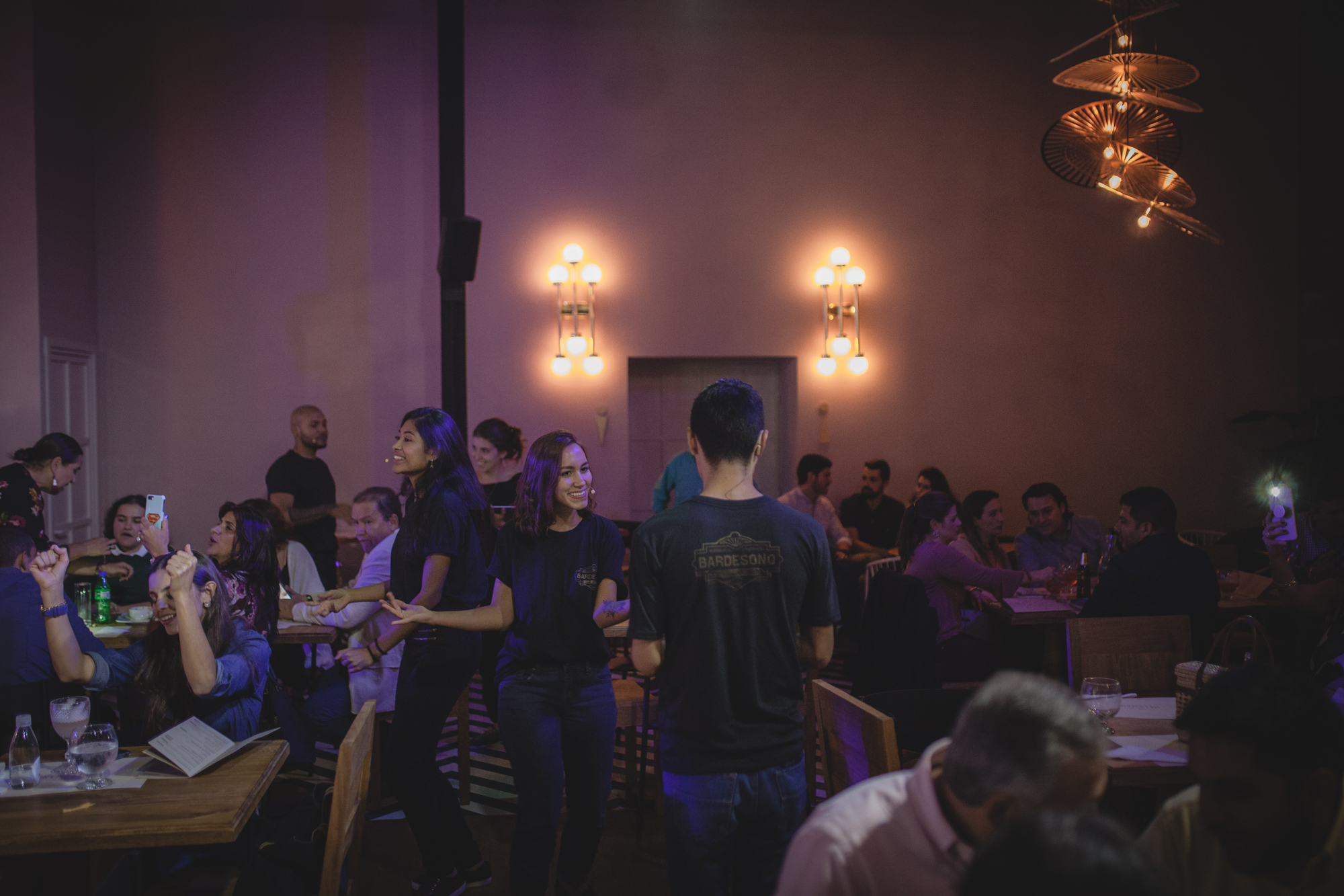 A trio of singers performing among the diners