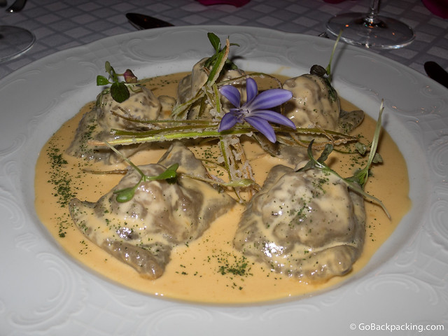 Ravioli in dehydrated forest mushroom dough, stuffed with Lamb in its own juices, flavored with black truffle oil