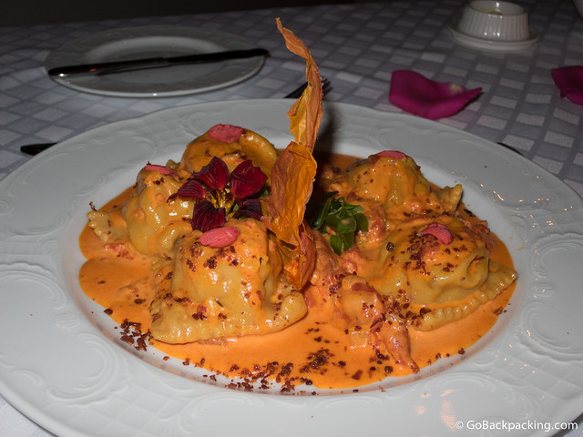 Ravioli in Iberian chorizo and bacon dough stuffed with manchego cheese and braised tenderloin with Scarparo sauce