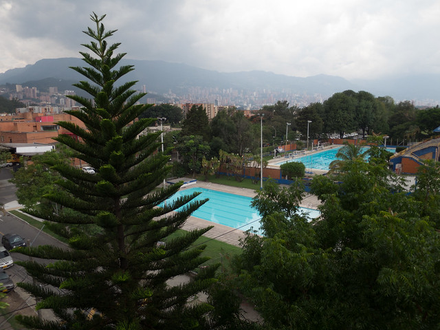 Public pools in the park across the street, with Poblado in the distance