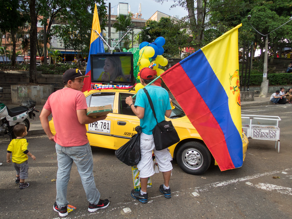 A taxi driver having some fun with the 2014 World Cup