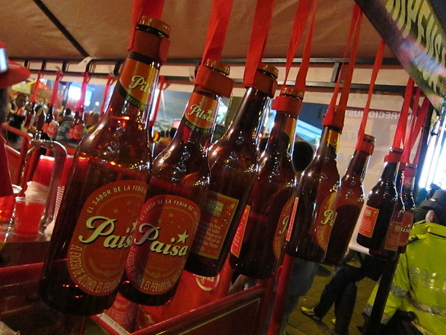 Plastic Pilsen bottles dangle, awaiting their fill of the local beer.