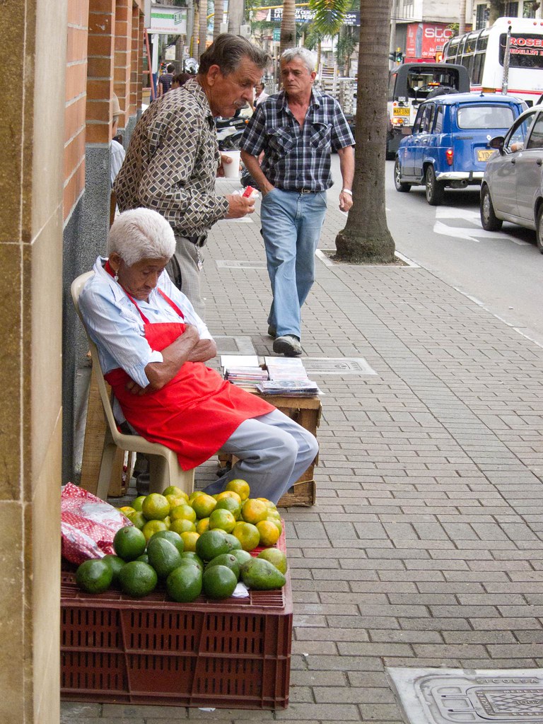 A woman selling avocados in Envigado