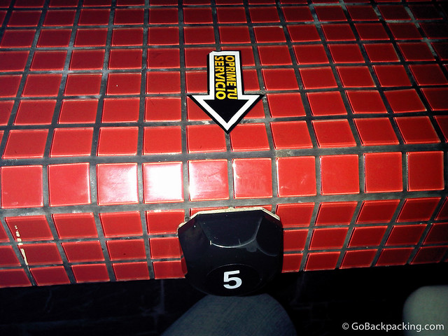 If you're sitting at the bar, which is wide enough to support the singers and club dancers, you'll need to push this button to call the waitress for drink orders.