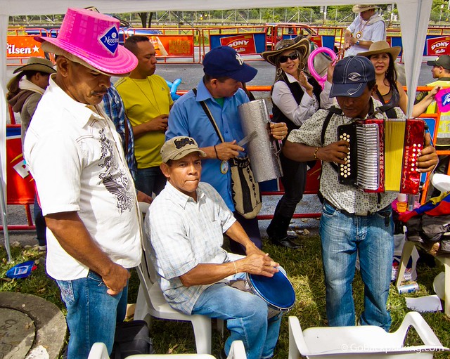 A group of men rock out along the parade route