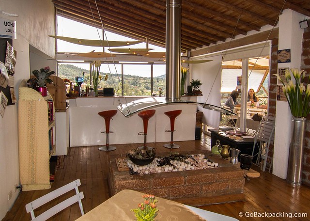 The interior features a modern fireplace, and local art hanging on the walls