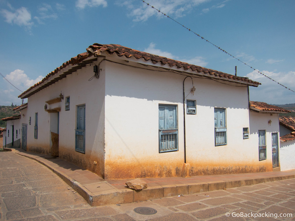 I love the faded blue paint on the windows and doors of this building