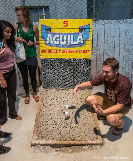 Shawn, the owner of Macondo Hostel, explaining the rules of Tejo