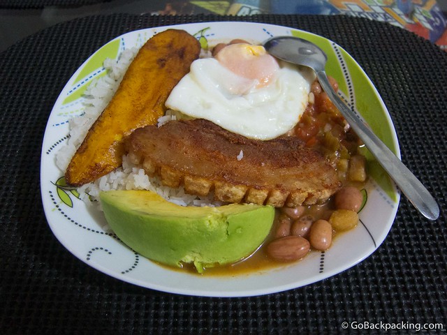 The finished product: beans, chicharron, a fried egg, avocado, rice, and plantain