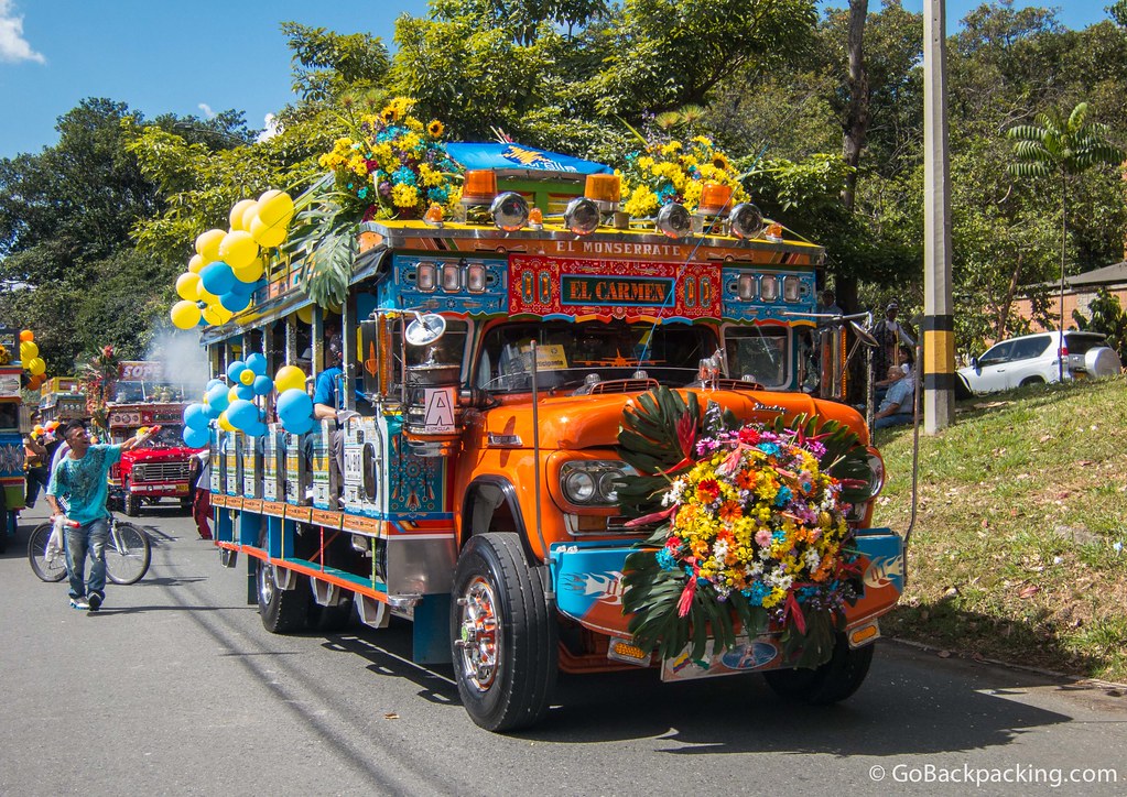 A vendor tries to sell sprayable carnival foam to passengers on this chiva from El Carmen