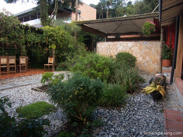Semi-private tables are located around the edges of the garden